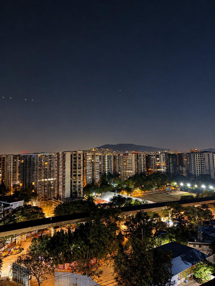 High-rises standing guard while the streetlights keep the night company.