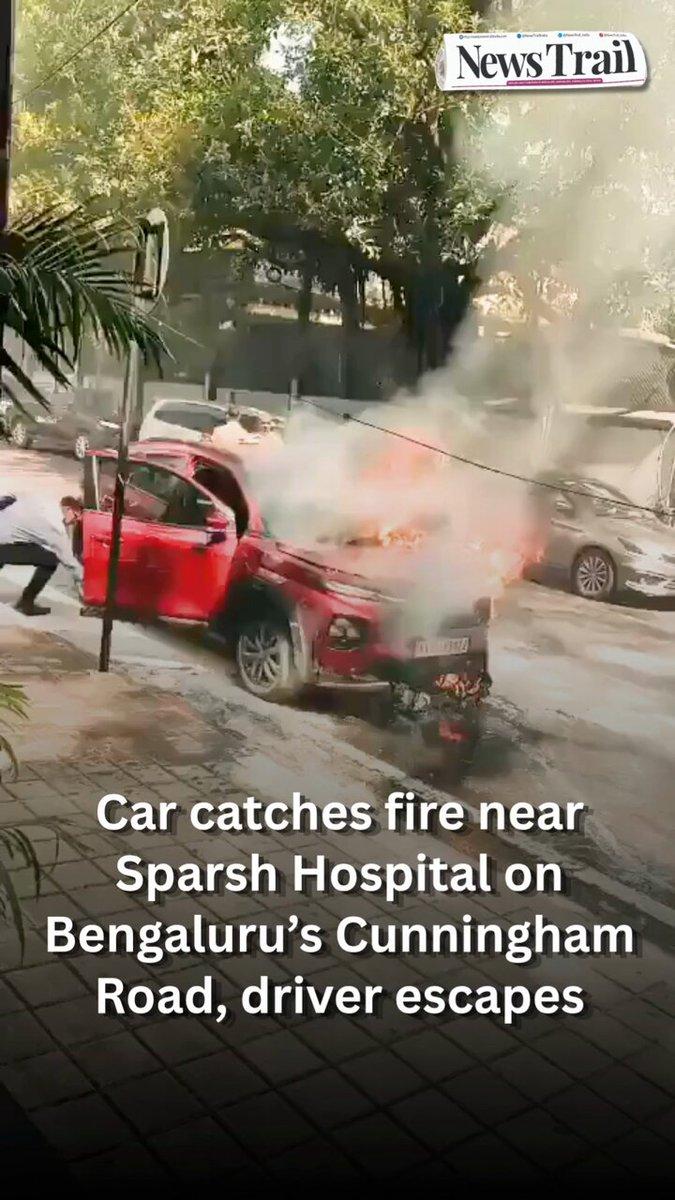 A car was reduced to a charred wreck after catching fire near Sparsh Hospital on Cunningham Road, Bengaluru, around 9:40 am on Saturday. The driver escaped safely, and no injuries were reported. Inves