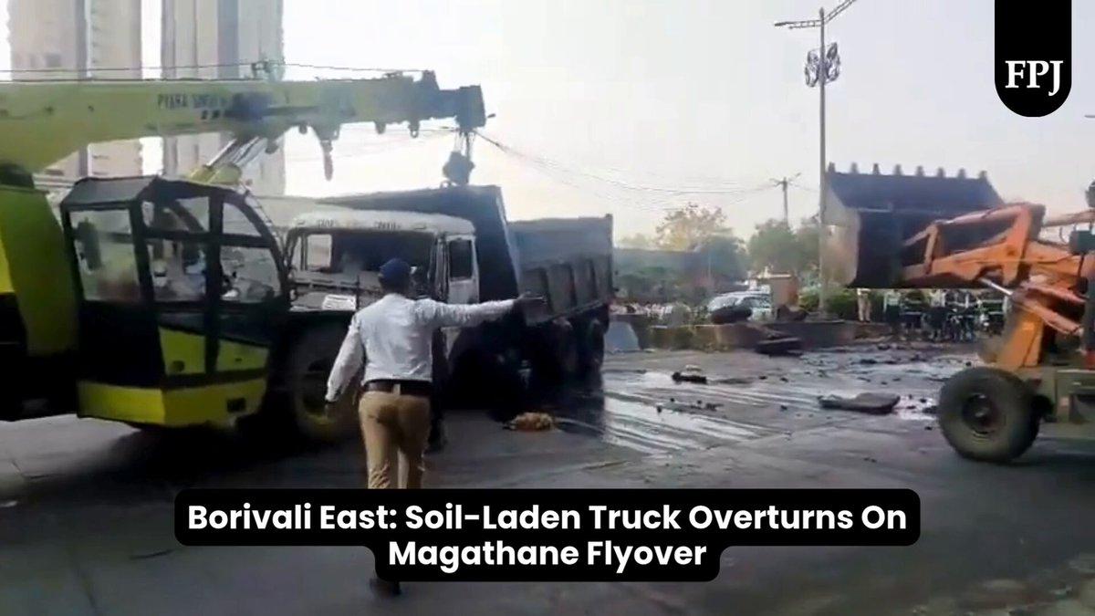 Borivali East: Soil-Laden Truck Overturns On Magathane Flyover 📹 @vijaygohil3419 | |