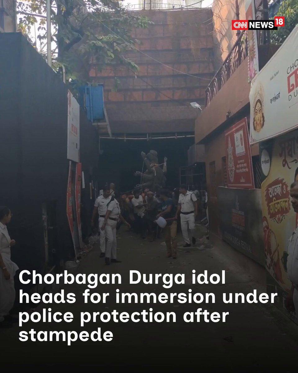 Maa Durga from Kolkata’s Chorbagan is en route to the Ganga ghat for immersion under heavy police protection following the stampede. Security has been tightened as the procession proceeds towards the
