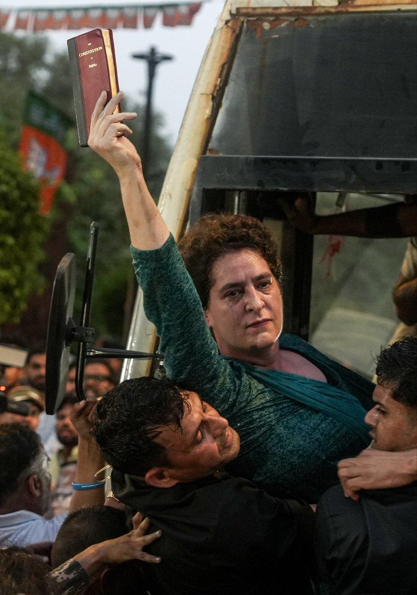 Congress leader @priyankagandhi holds a copy of the Constitution of India while being detained by the police during a protest against Chief Election Commissioner (CEC) Gyanesh Kumar, in New Delhi.
