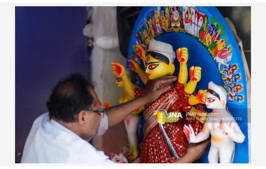 Kolkata, West Bengal, India – October 8, 2026: An artisan gives final touches to a clay idol of Goddess Durga ahead of Durga Puja at Kumartuli, Kolkata. Photo by: Rohit Kumar Shaw / JNA PRESS